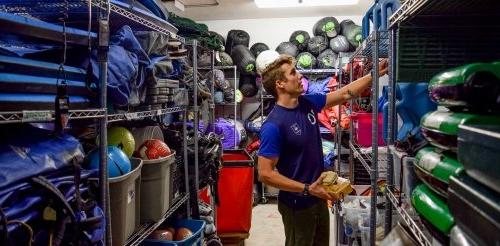 a student organizes items in the Pitzer's Gear Closet.